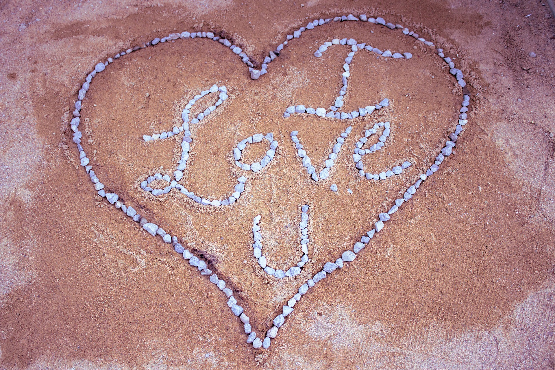 heart with I love you sign made of healing gemstones